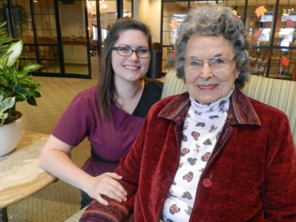 Resident smiling with employee